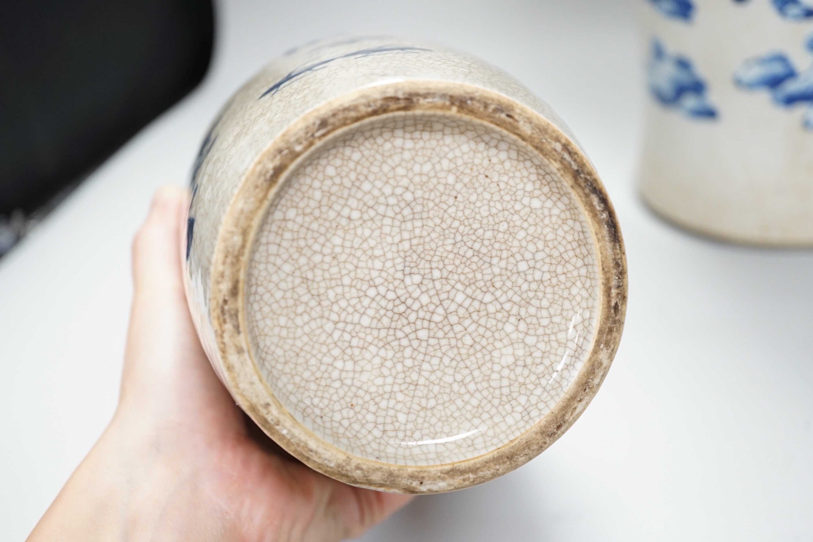 An early 20th century Chinese crackle glaze blue and white vase, 44cm and a later smaller vase